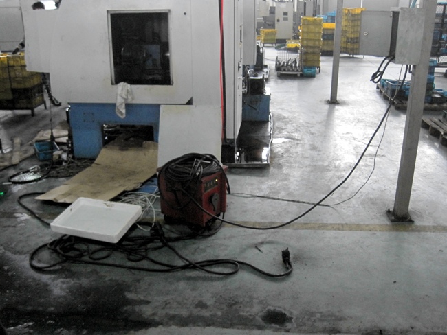 Welding equipment on floor close to water