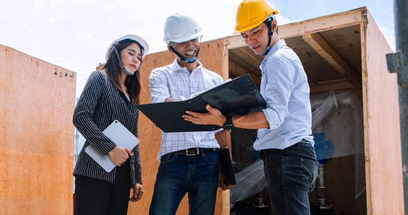 manufacturing workers discussing
