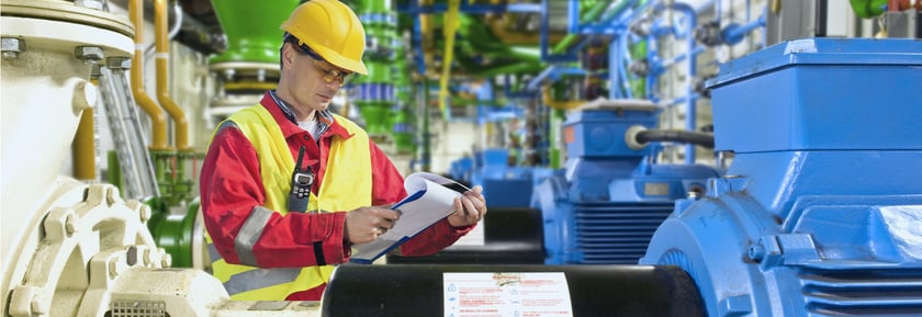factory engineer analyzing maintenance records