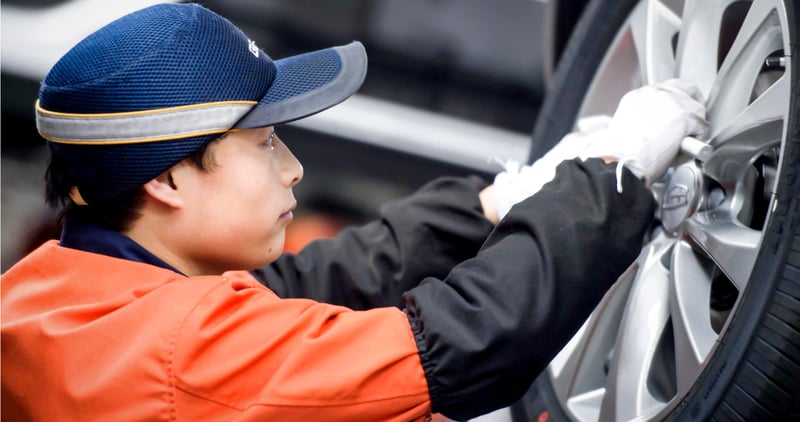 factory worker fixing equipment