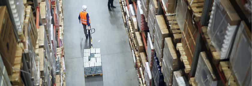 Worker pulling goods inventory in warehouse