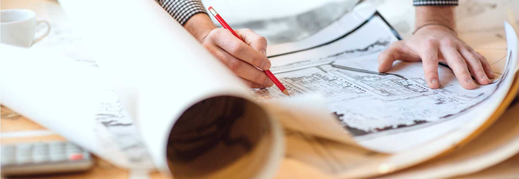 engineer looking over blueprints