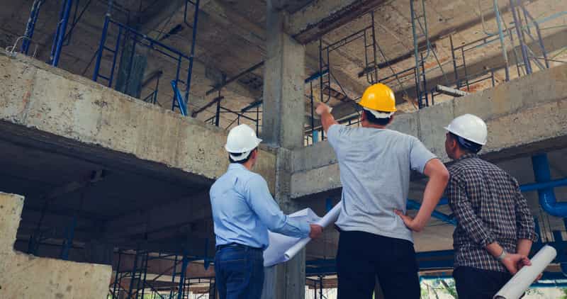 Engineers inspecting a factory for site selection