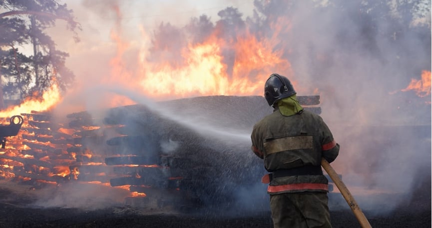 firefighter extinguishing fire 