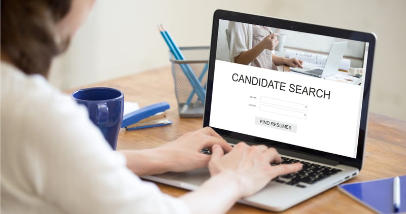 Person doing a candidate search on a laptop