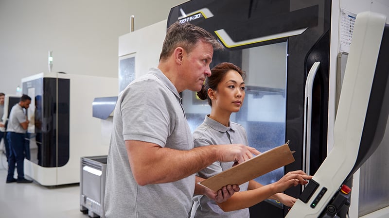 Manufacturing employees discussing
