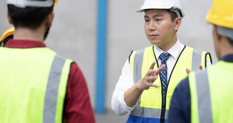 An engineer explaining the significance of Visual Management Board