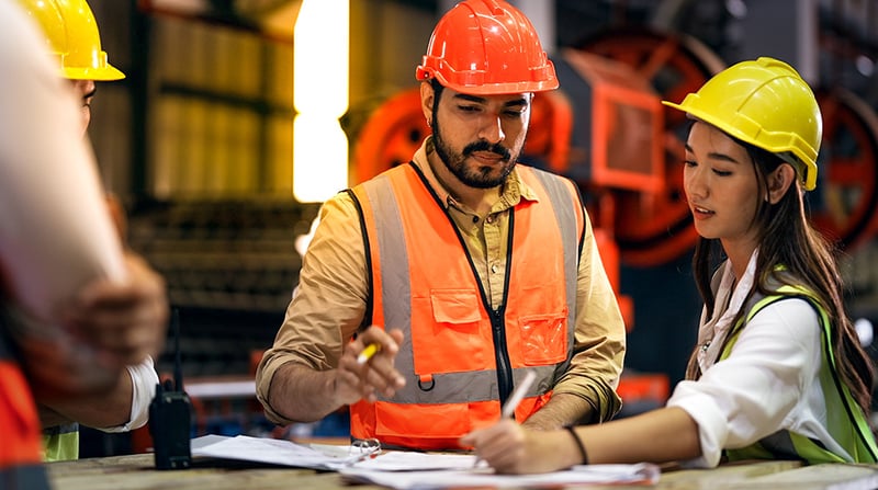 man and woman working in factory