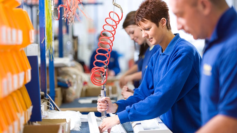 factory workers manufacturing products 