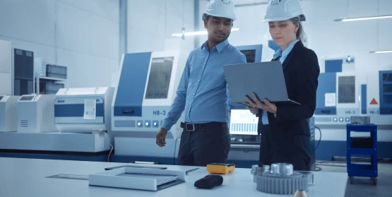 Engineers reviewing work on a factory