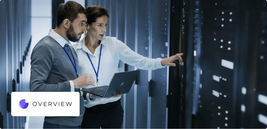 a man and woman inside a computer data centre room, with shoplogix logo