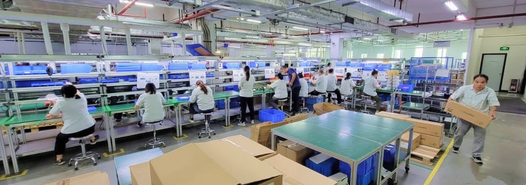 interior of a factory with factory workers working