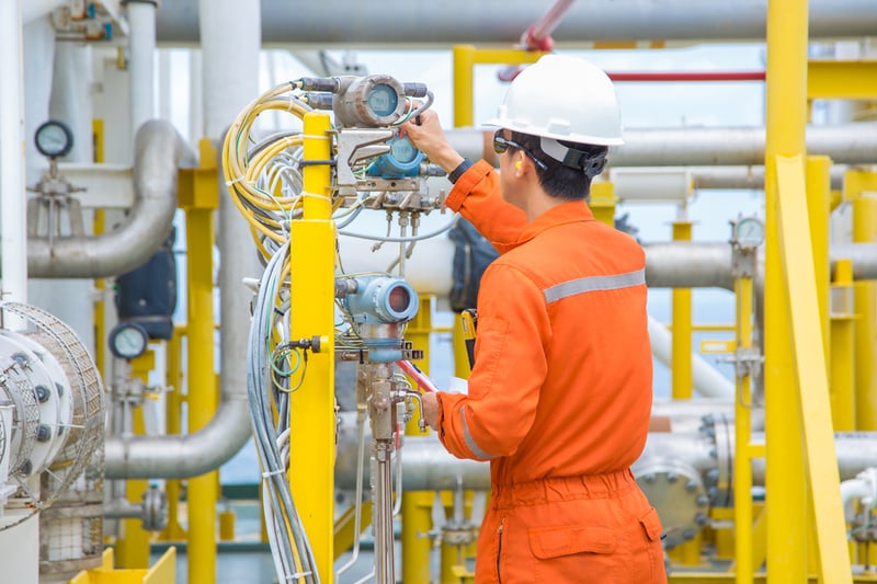 factory worker doing preventive maintenance